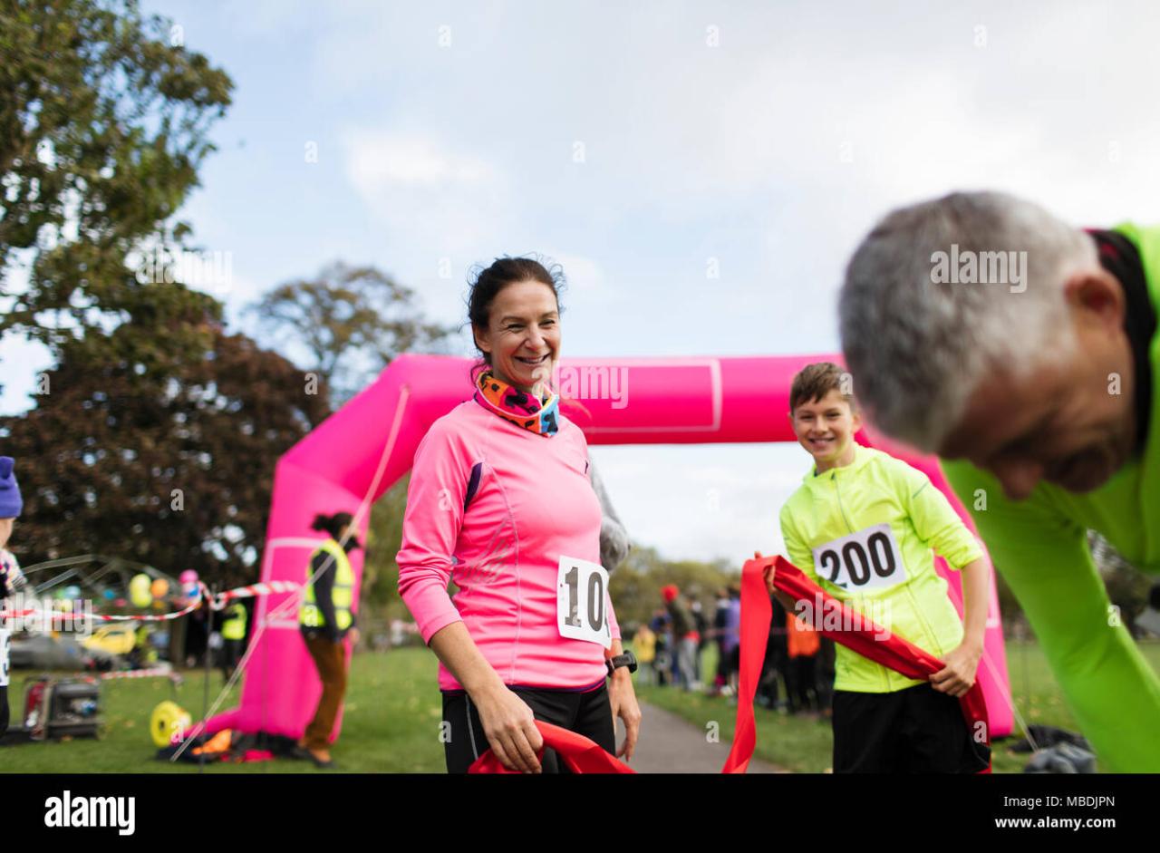 Family runners crossing finish line at charity run Stock Photo - Alamy Family runners crossing finish line at charity run Stock Photo - Alamy